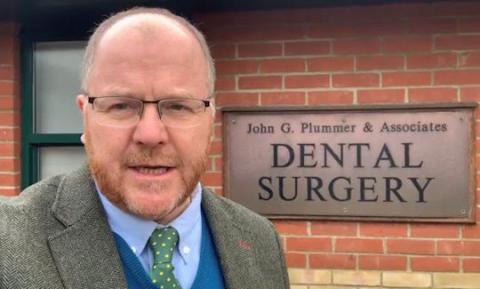 George Freeman MP standing outside a Dental Surgery